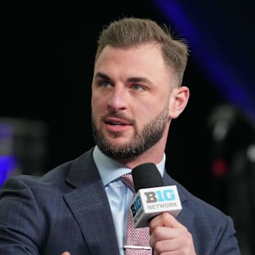 Jan 6, 2024; Houston, TX, USA; Michigan Wolverines former player Jake Butt talks on the Big Ten Network set  during media day before the College Football Playoff national championship game against the Washington Huskies at George R Brown Convention Center. Mandatory Credit: Kirby Lee-Imagn Images