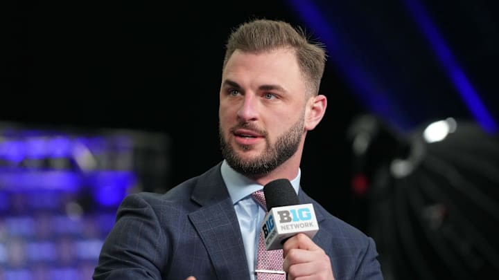 Jan 6, 2024; Houston, TX, USA; Michigan Wolverines former player Jake Butt talks on the Big Ten Network set  during media day before the College Football Playoff national championship game against the Washington Huskies at George R Brown Convention Center. Mandatory Credit: Kirby Lee-Imagn Images