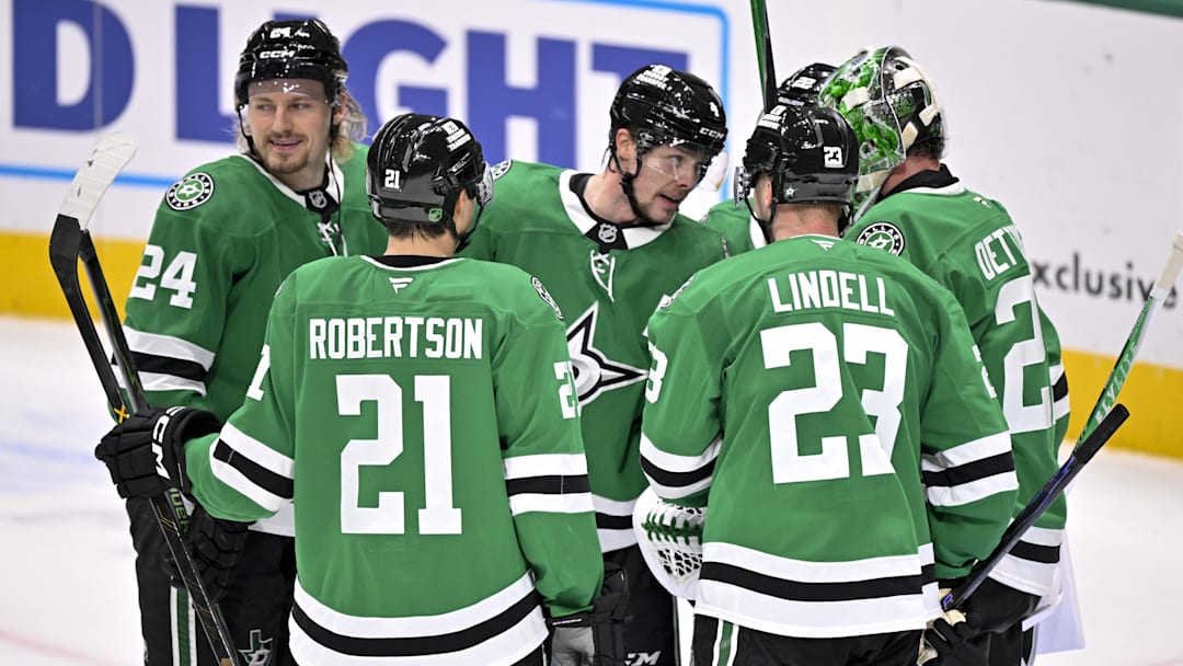 Feb 4, 2026; Dallas, Texas, USA; Dallas Stars center Roope Hintz (24) and defenseman Miro Heiskanen (4) and left wing Jason Robertson (21) and defenseman Esa Lindell (23) and goaltender Jake Oettinger (29) celebrate after the Stars defeat the St. Louis Blues at the American Airlines Center. Mandatory Credit: Jerome Miron-Imagn Images