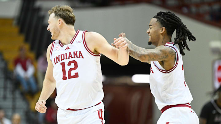 Indiana Hoosiers forward Tucker Devries (12) and guard Lamar Wilkerson (3) 