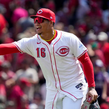 Cincinnati Reds pitcher Lucas Sims (39) and third base Noelvi Marte (16) celebrate a win after the ninth inning of the MLB National League game between the Cincinnati Reds and the Colorado Rockies at Great American Ball Park in downtown Cincinnati on Thursday, July 11, 2024. The Reds led 3-0 after three innings. The Reds won 8-1.