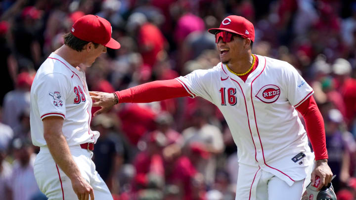 Cincinnati Reds pitcher Lucas Sims (39) and third base Noelvi Marte (16) celebrate a win after the ninth inning of the MLB National League game between the Cincinnati Reds and the Colorado Rockies at Great American Ball Park in downtown Cincinnati on Thursday, July 11, 2024. The Reds led 3-0 after three innings. The Reds won 8-1.