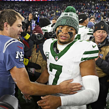 Nov 13, 2025; Foxborough, Massachusetts, USA; New England Patriots quarterback Drake Maye (10) and New York Jets quarterback Justin Fields (7) react after the game at Gillette Stadium. Mandatory Credit: Eric Canha-Imagn Images