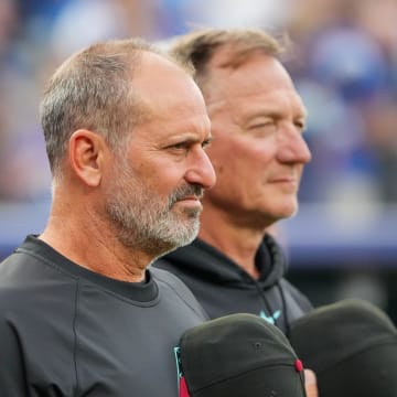 Jul 24, 2024; Kansas City, Missouri, USA; Arizona Diamondbacks manager Torey Lovullo (17) stands on the field during the national anthem prior to a game against the Kansas City Royals at Kauffman Stadium. Mandatory Credit: Denny Medley-USA TODAY Sports