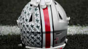 Oct. 14, 2023; Lafayette, In., USA; 
Gloves lie on top of the helmet of Ohio State Buckeyes wide receiver Julian Fleming (4) before Saturday's NCAA Division I football game against the Purdue Boilermakers at Ross-Ade Stadium in Lafayette.