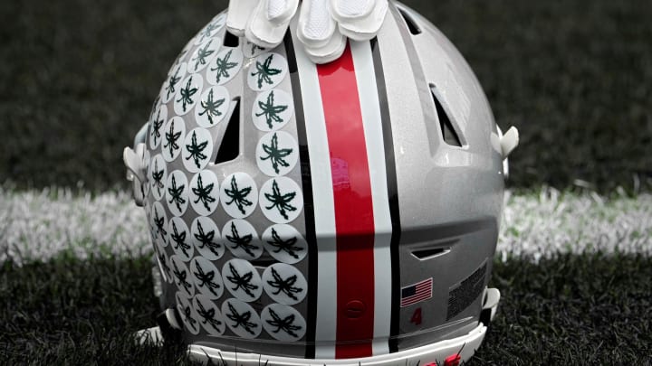 Oct. 14, 2023; Lafayette, In., USA; 
Gloves lie on top of the helmet of Ohio State Buckeyes wide receiver Julian Fleming (4) before Saturday's NCAA Division I football game against the Purdue Boilermakers at Ross-Ade Stadium in Lafayette.