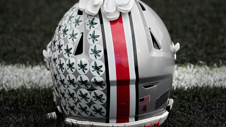 Oct. 14, 2023; Lafayette, In., USA; 
Gloves lie on top of the helmet of Ohio State Buckeyes wide receiver Julian Fleming (4) before Saturday's NCAA Division I football game against the Purdue Boilermakers at Ross-Ade Stadium in Lafayette.