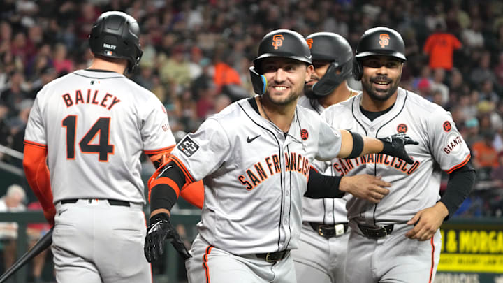 Sep 24, 2024; Phoenix, Arizona, USA; San Francisco Giants outfielder Michael Conforto (8) celebrates with catcher Patrick Bailey (14) and first base LaMonte Wade Jr. (31) after hitting a three-run home run against the Arizona Diamondbacks in the third inning at Chase Field. Mandatory Credit: Rick Scuteri-Imagn Images
