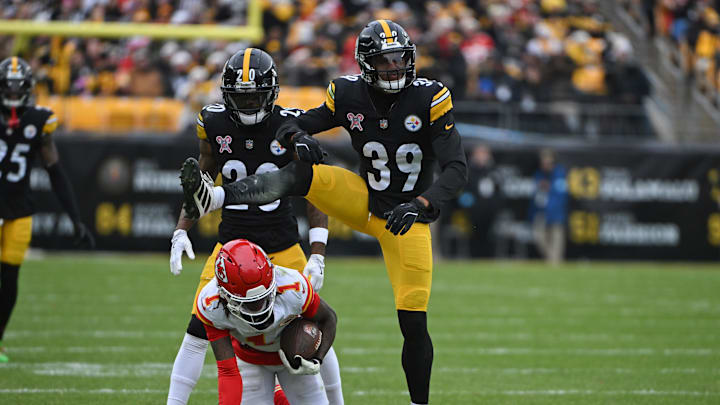 Dec 25, 2024; Pittsburgh, Pennsylvania, USA; Pittsburgh Steelers safety Minkah Fitzpatrick (39) reacts after tackling Kansas City Chiefs wide receiver Xavier Worthy (1) during the second quarter at Acrisure Stadium. Mandatory Credit: Barry Reeger-Imagn Images
