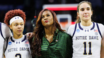 Notre Dame head coach Niele Ivey, center, guards Hannah Hidalgo (3) and Sonia Citron (11) look on after winning the second round of the NCAA Women's Basketball Tournament 76-55 against Michigan at Purcell Pavilion on Sunday, March 23, 2025, in South Bend.