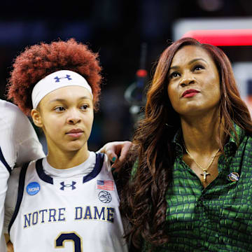 Notre Dame head coach Niele Ivey, center, guards Hannah Hidalgo (3) and Sonia Citron (11) look on after winning the second round of the NCAA Women's Basketball Tournament 76-55 against Michigan at Purcell Pavilion on Sunday, March 23, 2025, in South Bend.