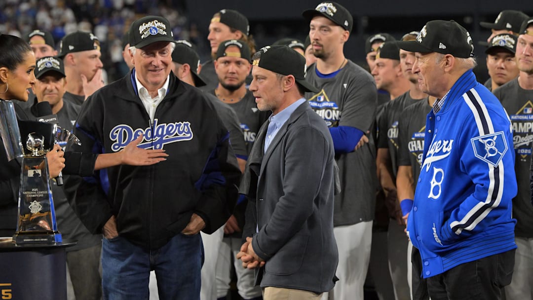 Oct 17, 2025; Los Angeles, California, USA; Lauren Shehadi interviews (from right to left) Dodgers owner Mark Walter, president of baseball operations Andrew Friedman, and president Stan Kasten after defeating the Milwaukee Brewers in game four of the NLCS round for the 2025 MLB playoffs at Dodger Stadium. Mandatory Credit: Jayne Kamin-Oncea-Imagn Images Oct 17, 2025; Los Angeles, California, USA; Lauren Shehadi interviews (from right to left) Dodgers owner Mark Walter, president of baseball operations Andrew Friedman, and president Stan Kasten after defeating the Milwaukee Brewers in game four of the NLCS round for the 2025 MLB playoffs at Dodger Stadium. Mandatory Credit: Jayne Kamin-Oncea-Imagn Images