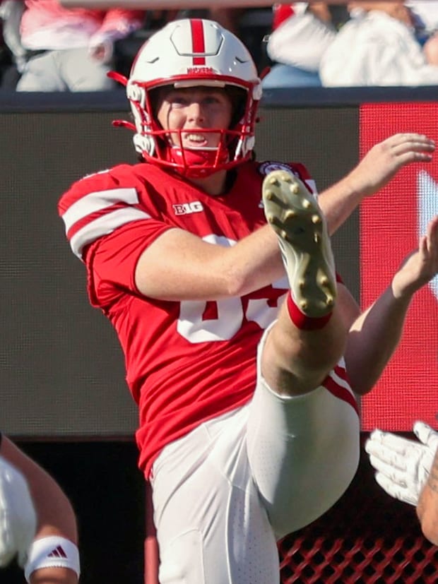 Nebraska's Archie Wilson punts the ball against Michigan State.