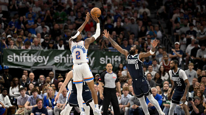 May 13, 2024; Dallas, Texas, USA; Oklahoma City Thunder guard Shai Gilgeous-Alexander (2) makes a jump shot over Dallas Mavericks guard Kyrie Irving (11) during the second half in game four of the second round for the 2024 NBA playoffs at American Airlines Center. Mandatory Credit: Jerome Miron-USA TODAY Sports