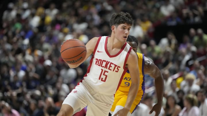 Jul 12, 2024; Las Vegas, NV, USA;  Houston Rockets guard Reed Sheppard (15) dribbles the ball against Los Angeles Lakers guard Bronny James (9) during the first half at the Thomas & Mack Center. Mandatory Credit: Lucas Peltier-USA TODAY Sports