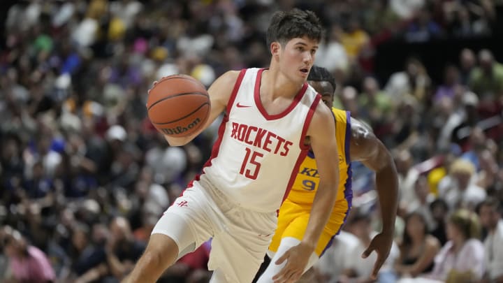 Jul 12, 2024; Las Vegas, NV, USA;  Houston Rockets guard Reed Sheppard (15) dribbles the ball against Los Angeles Lakers guard Bronny James (9) 