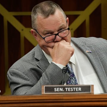 Senator Jon Tester (D-Mont.) listens to Secretary of Defense Lloyd J. Austin III at a Senate Appropriations Subcommittee on Defense hearing.