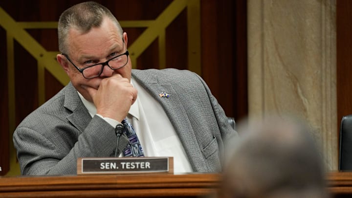 Senator Jon Tester (D-Mont.) listens to Secretary of Defense Lloyd J. Austin III at a Senate Appropriations Subcommittee on Defense hearing.