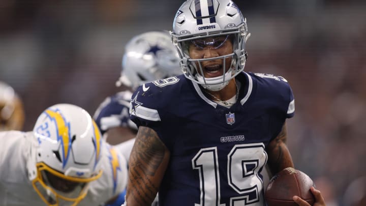 Aug 24, 2024; Arlington, Texas, USA; Dallas Cowboys quarterback Trey Lance (19) runs for a touchdown against the Los Angeles Chargers in the third quarter at AT&T Stadium. 