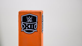 Dec 7, 2024; Arlington, TX, USA; A view of the WWE and Big 12 logo during the game between the Iowa State Cyclones and the Arizona State Sun Devils at AT&T Stadium. Mandatory Credit: Jerome Miron-Imagn Images