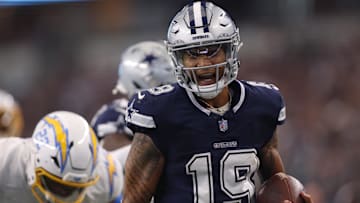 Dallas Cowboys quarterback Trey Lance (19) runs for a touchdown against the Los Angeles Chargers in the third quarter at AT&T Stadium.