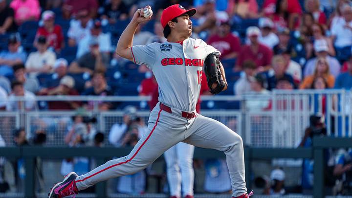 Jun 14, 2026; Omaha, NE, USA; Georgia Bulldogs starting pitcher Caden Aoki (12) pitches against the Oklahoma Sooners during the first inning at Charles Schwab Field. Mandatory Credit: Dylan Widger-Imagn Images