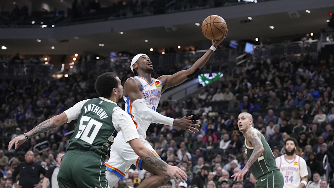 Jan 21, 2026; Milwaukee, Wisconsin, USA; Oklahoma City Thunder guard Shai Gilgeous-Alexander (2) drives to the basket against Milwaukee Bucks guard Cole Anthony (50) and m18/ in the first half at Fiserv Forum. Mandatory Credit: Michael McLoone-Imagn Images Jan 21, 2026; Milwaukee, Wisconsin, USA; Oklahoma City Thunder guard Shai Gilgeous-Alexander (2) drives to the basket against Milwaukee Bucks guard Cole Anthony (50) and m18/ in the first half at Fiserv Forum. Mandatory Credit: Michael McLoone-Imagn Images