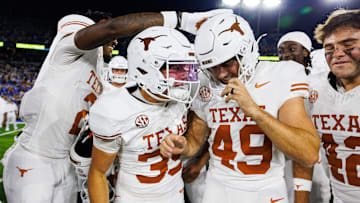 Texas Longhorns wide receiver Jaime Ffrench Jr. (2) and wide receiver Rett Andersen (35) celebrate with kicker Mason Shipley (49) on Oct. 18 at Kroger Field in Lexington, Kentucky.
