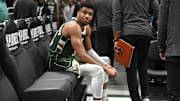 Apr 26, 2023; Milwaukee, Wisconsin, USA; Milwaukee Bucks forward Giannis Antetokounmpo (34) sits on the bench after a 128-126 loss to the Miami Heat during game five of the 2023 NBA Playoffs at Fiserv Forum. Mandatory Credit: Michael McLoone-Imagn Images