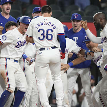 Texas Rangers center fielder Wyatt Langford (36) arrives home to teammates on his grand slam walk-off against the New York Yankees during the ninth inning at Globe Life Field on Sept 3.