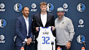Dallas Mavericks general manager Nico Harrison and first overall pick Cooper Flagg and coach Jason Kidd pose for a photo 