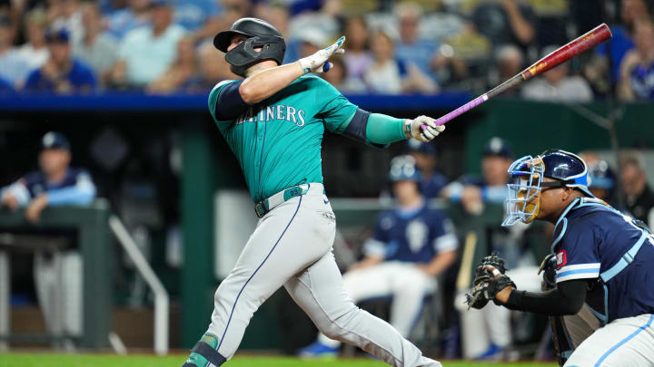 Jun 7, 2024; Kansas City, Missouri, USA; Seattle Mariners first baseman Ty France (23) hits a double during the eighth inning against the Kansas City Royals at Kauffman Stadium. 