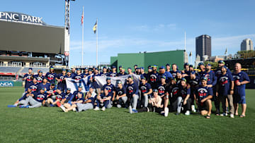 The Chicago Cubs celebrate on the field after defeating the Pittsburgh Pirates to secure a spot in the 2025 playoffs.