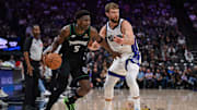 Nov 9, 2025; Sacramento, California, USA; Minnesota Timberwolves guard Anthony Edwards (5) dribbles the ball against Sacramento Kings forward Domantas Sabonis (11) during the third quarter at Golden 1 Center.