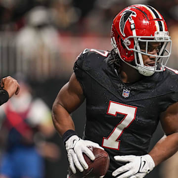 Nov 26, 2023; Atlanta, Georgia, USA; Atlanta Falcons running back Bijan Robinson (7) reacts after scoring a touchdown after a catch against the New Orleans Saints during the second half at Mercedes-Benz Stadium. Mandatory Credit: Dale Zanine-Imagn Images