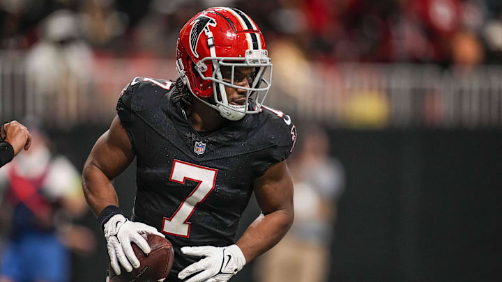 Nov 26, 2023; Atlanta, Georgia, USA; Atlanta Falcons running back Bijan Robinson (7) reacts after scoring a touchdown after a catch against the New Orleans Saints during the second half at Mercedes-Benz Stadium. Mandatory Credit: Dale Zanine-Imagn Images