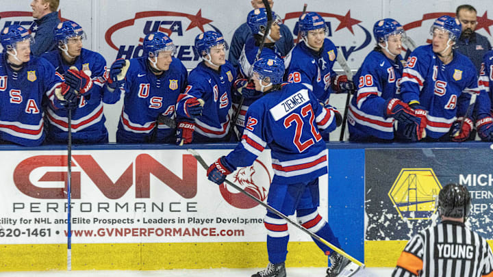 Aug 3, 2024; Plymouth, MI, USA; USA’s forward Brody Ziemer (22) celebrates his game wining goal on his shoot out attempt against Canada of the 2024 World Junior Summer Showcase at USA Hockey Arena. Mandatory Credit: David Reginek-Imagn Images