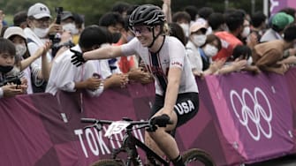 Jul 27, 2021; Tokyo, Japan; Haley Batten (USA) celebrates crossing the line in the Women's Cross Country during the Tokyo 2020 Olympic Summer Games at Izu MTB Course. Mandatory Credit: Andrew P. Scott-USA TODAY Network