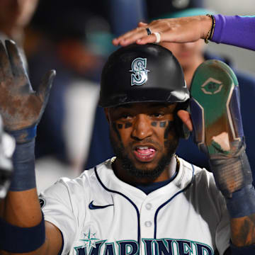 Seattle Mariners center fielder Victor Robles (10) celebrates in the dugout after scoring a run against the Texas Rangers during the fifth inning at T-Mobile Park on Sept 12.