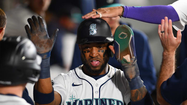 Seattle Mariners center fielder Victor Robles (10) celebrates in the dugout after scoring a run against the Texas Rangers during the fifth inning at T-Mobile Park on Sept 12.