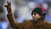 Dec 21, 2024; Baltimore, Maryland, USA;  Stephen A. Smith , American sports television personality, waves to the crowd while walking the field before the game between the Baltimore Ravens and the Pittsburgh Steelers at M&T Bank Stadium.