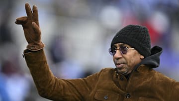 Dec 21, 2024; Baltimore, Maryland, USA;  Stephen A. Smith , American sports television personality, waves to the crowd while walking the field before the game between the Baltimore Ravens and the Pittsburgh Steelers at M&T Bank Stadium.