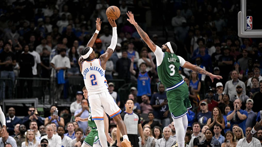 Oct 27, 2025; Dallas, Texas, USA; Oklahoma City Thunder guard Shai Gilgeous-Alexander (2) makes a jump shot over Dallas Mavericks forward Anthony Davis (3) during the second half at the American Airlines Center. Mandatory Credit: Jerome Miron-Imagn Images