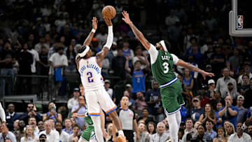 Oct 27, 2025; Dallas, Texas, USA; Oklahoma City Thunder guard Shai Gilgeous-Alexander (2) makes a jump shot over Dallas Mavericks forward Anthony Davis (3) during the second half at the American Airlines Center. Mandatory Credit: Jerome Miron-Imagn Images