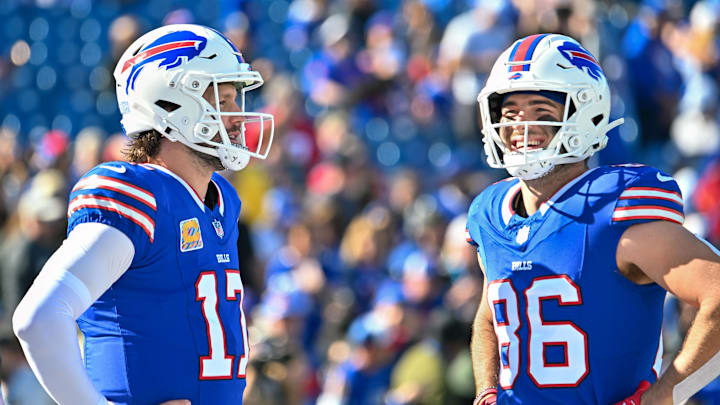 Oct 20, 2024; Orchard Park, New York, USA; Buffalo Bills quarterback Josh Allen (17) and tight end Dalton Kincaid (86) have a word before a game against the Tennessee Titans at Highmark Stadium. Mandatory Credit: Mark Konezny-Imagn Images