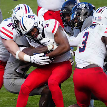 Nov 11, 2023; Boulder, Colorado, USA; Arizona Wildcats wide receiver Montana Lemonious-Craig (5) carries the ball in the fourth quarter against the Colorado Buffaloes at Folsom Field. Mandatory Credit: Ron Chenoy-Imagn Images