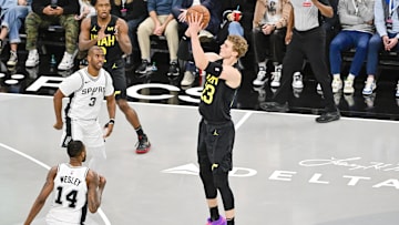 Nov 26, 2024; Salt Lake City, Utah, USA; Utah Jazz forward/center Lauri Markkanen (23) takes a three point shot over San Antonio Spurs guard Blake Wesley (14) and guard Chris Paul (3) during the second half at Delta Center. Mandatory Credit: Christopher Creveling-Imagn Images