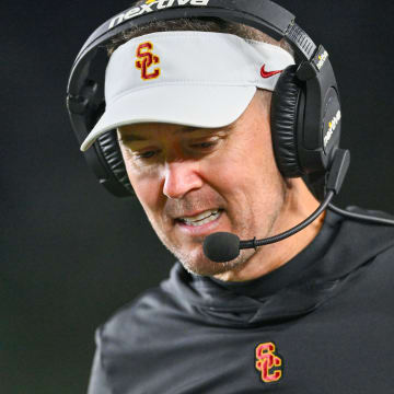 Oct 14, 2023; South Bend, Indiana, USA; USC Trojans head coach Lincoln Riley talks on his headset in the third quarter against the Notre Dame Fighting Irish at Notre Dame Stadium.  