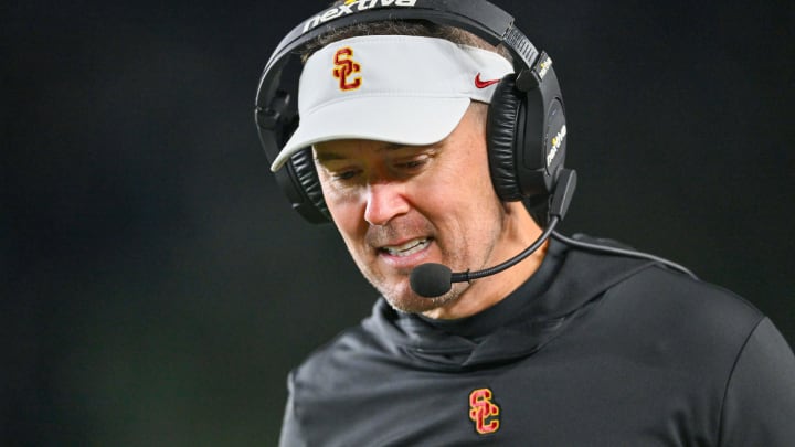 Oct 14, 2023; South Bend, Indiana, USA; USC Trojans head coach Lincoln Riley talks on his headset in the third quarter against the Notre Dame Fighting Irish at Notre Dame Stadium.  