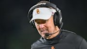 Oct 14, 2023; South Bend, Indiana, USA; USC Trojans head coach Lincoln Riley talks on his headset in the third quarter against the Notre Dame Fighting Irish at Notre Dame Stadium. Mandatory Credit: Matt Cashore-Imagn Images